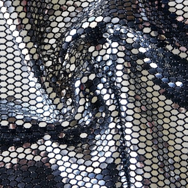 Armor Honeycomb Sequin - Silver/Black features ultra shiny silver flat mirror sequins in a honeycomb pattern on black stretch base fabric.