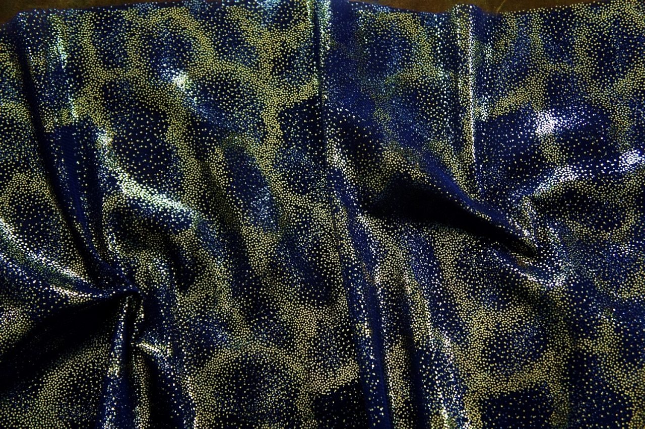 Fairydust Navy Foil Mesh Fabric features an enchanting gold foil pattern on sheer, navy non-stretch mesh base fabric for a soft, dreamy glow.