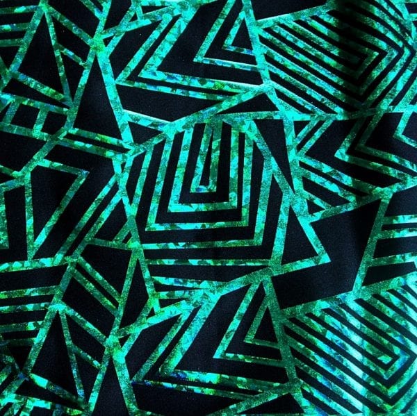 Kelly Green Geometric stretch fabric features bold geometric designs in "Broken Glass" hologram foil on black stretch base fabric for a stunning contrast effect.  - SOLID STONE FABRICS, INC.