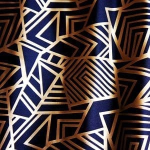 Geometry Matte Gold Geometric fabric features bold geometric designs in a sleek matte gold foil on black stretch base fabric for a stunning contrast effect. - SOLID STONE FABRICS, INC.
