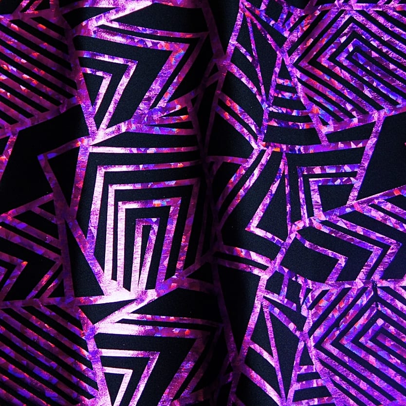 Purple Geometric Stretch fabric features bold geometric designs in "Broken Glass" hologram foil on black stretch base fabric for a stunning contrast effect.  - SOLID STONE FABRICS, INC.