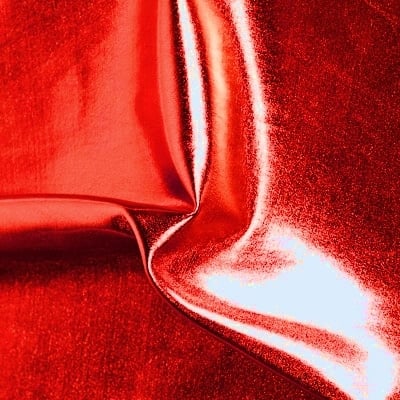 Red Stretch Lame fabric features full coverage metallic foil on 4 way stretch base fabric for an intense liquid shine effect.