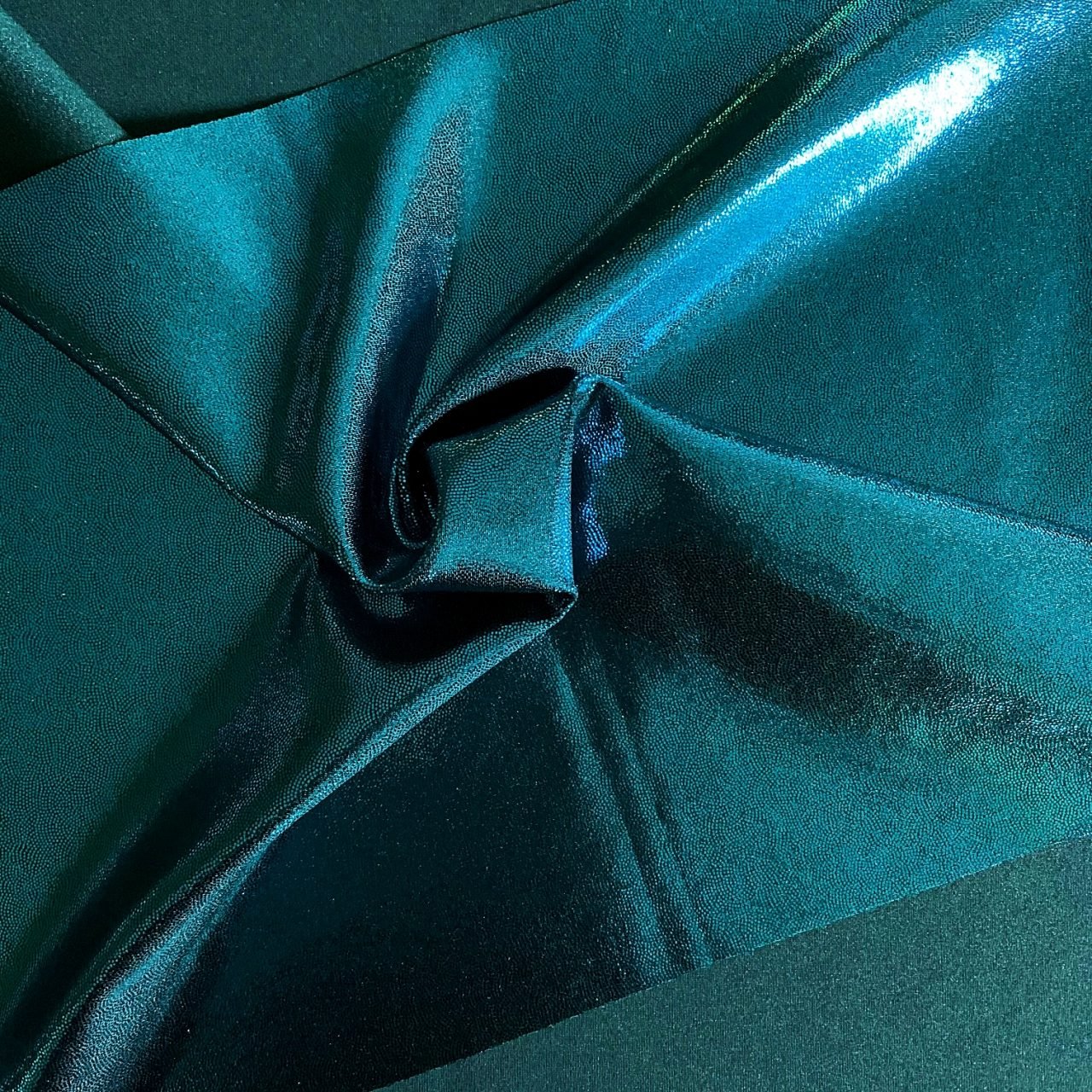 Turquoise Foil Fabric is perfect for dance, cheer, bows, gymnastics, figure skating, costume, cosplay, apparel and more.