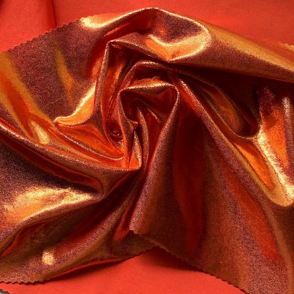 Orange Metallic Spandex Fabric is perfect for dance, cheer, bows, gymnastics, figure skating, costume, cosplay, apparel and more.