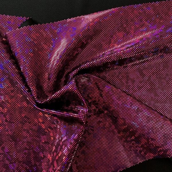 Fuchsia Shattered Glass Fabric featuring black stretch base fabric topped with fuchsia shattered glass holographic foil, for brilliant shine and sparkle.