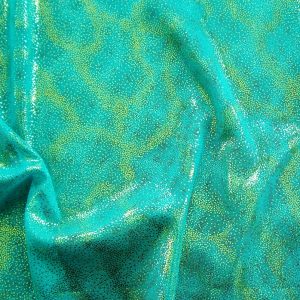 Fairydust Teal Foil Mesh Fabric features an enchanting gold foil pattern on sheer, teal non-stretch mesh base fabric for a soft, dreamy glow. 