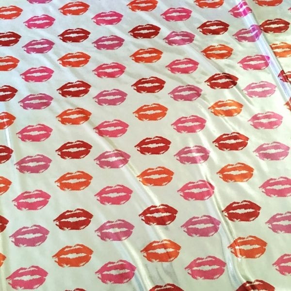 Kisses print fabric on Metallic Sheen