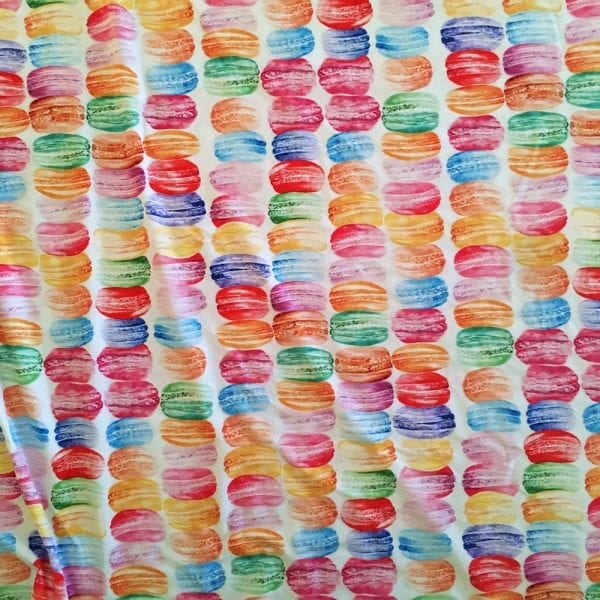 Multicolored french macarons printed on Carvico VITA recycled yarn print base.