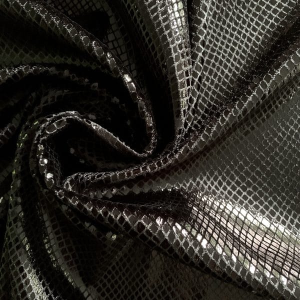 Our Python - Black/Black shiny black snakeskin velvet fabric features plush black 4-way stretch velvet topped with shiny black snakeskin foil for an ultra-sleek, modern look. 