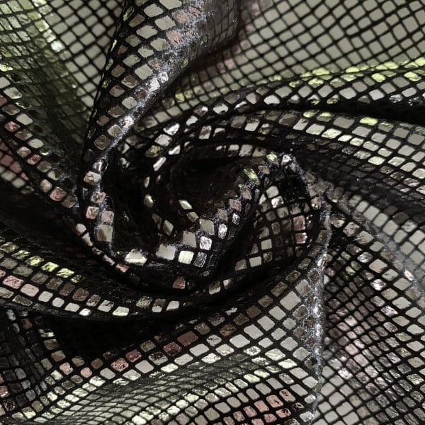 Python - Titanium/Black titanium grey snakeskin foil velvet fabric features plush black 4-way stretch velvet topped with shiny titanium grey snakeskin foil for an ultra-sleek, modern look.